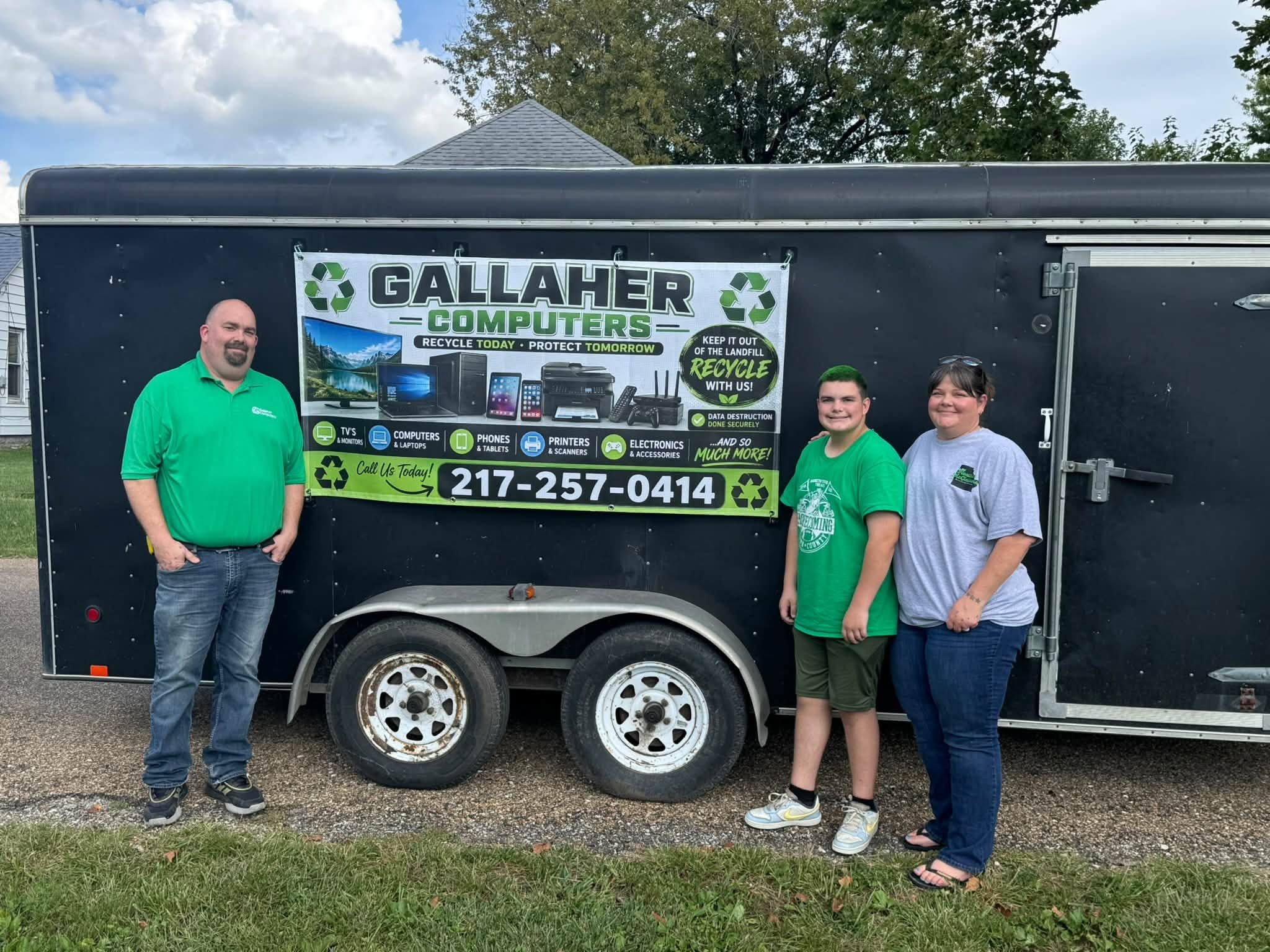 Gallaher Computers family team with recycling trailer